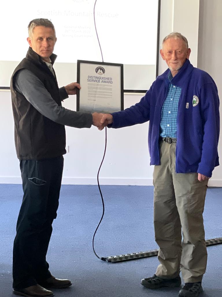 Seymour receiving his Distinguished Service Award from Damon Powell